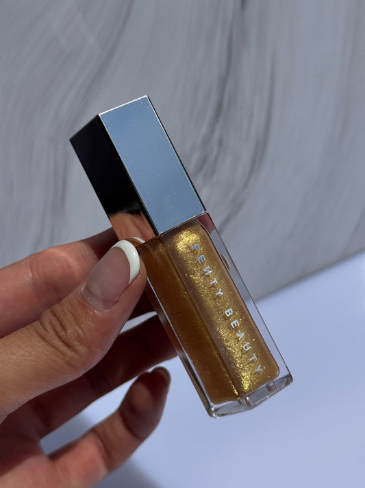 Gloss Luminizer Fenty Beauty Tono- TROPHY WIFE (sin caja)
