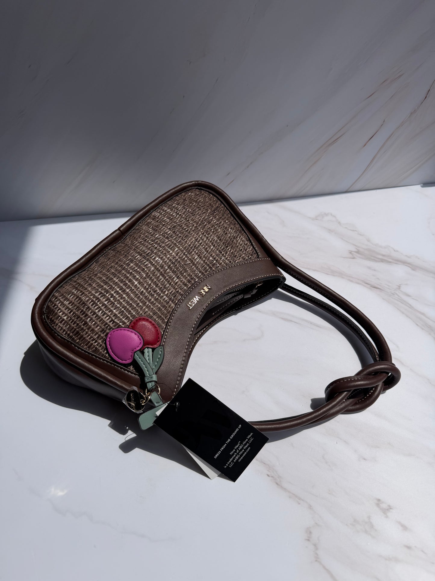 Hand Bag NINE WEST- café con accesorios (chica)