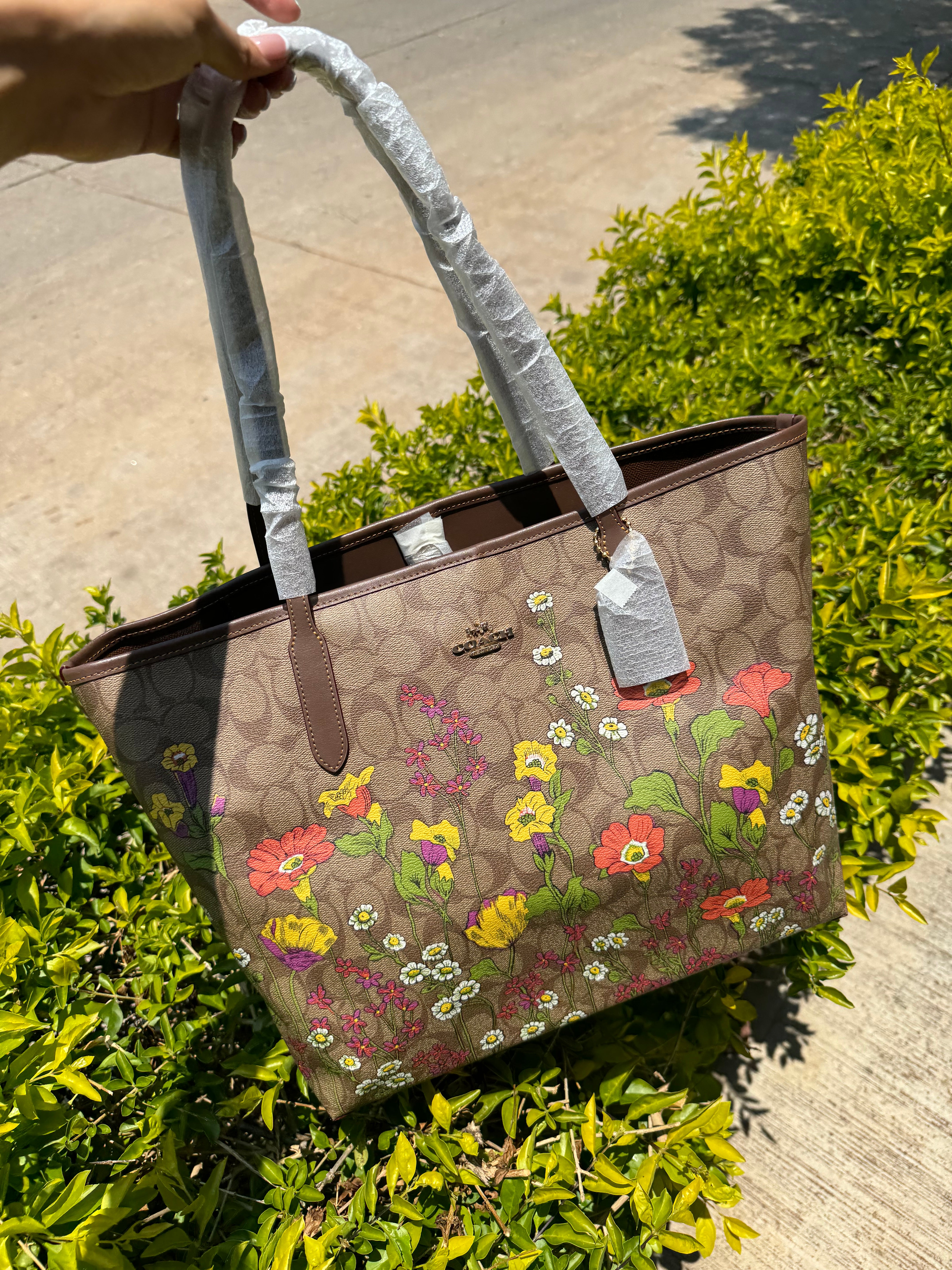 Bolsa coach de flores sale